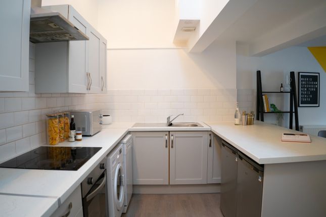 A Bright And Modern Kitchenette With Ample Counter...