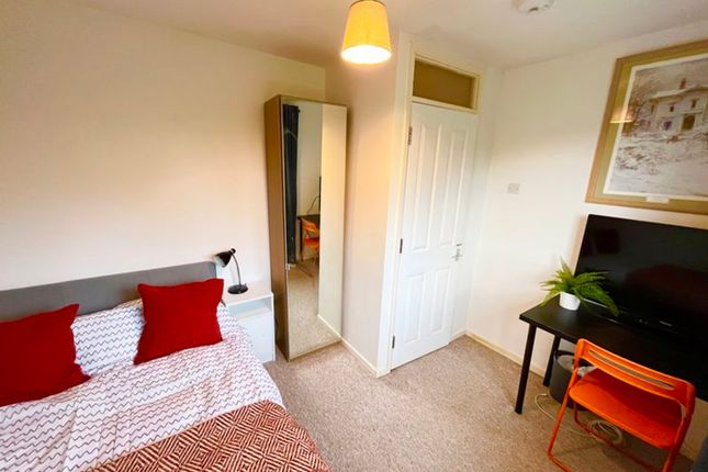 This Cozy Double Bedroom Features A Comfortable Be...