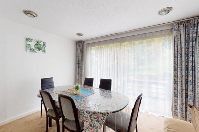 A Bright And Welcoming Living Room With A Large Wi...