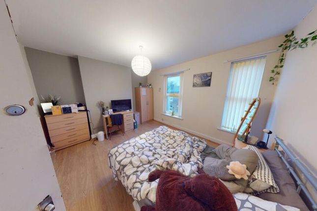 A Spacious, Well-Lit Master Bedroom Featuring A Co...