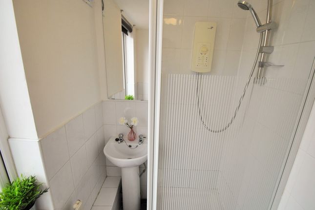 A Modern Bathroom Featuring A Sleek Shower Unit, S...