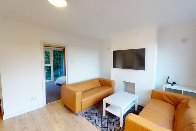 A Bright And Inviting Large Modern Living Room Fea...