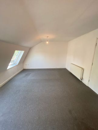 A Clean And Simple Room With Neutral Walls And A l...