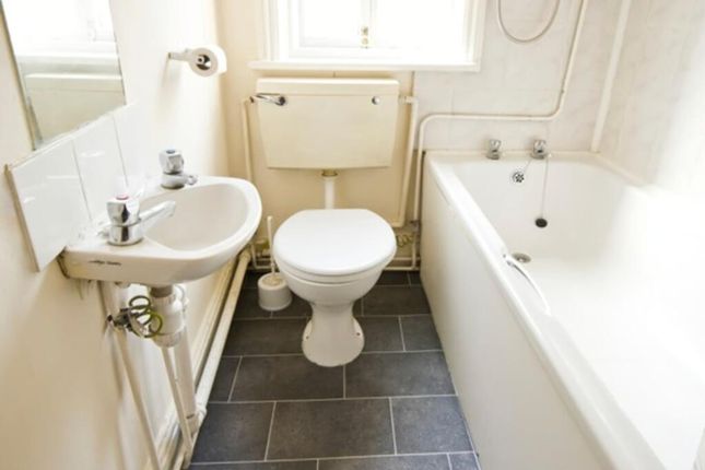 A Clean And Tidy Bathroom Featuring A Bath And Mod...