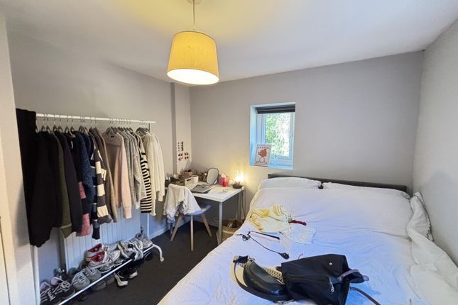 A Bright And Tidy Double Bedroom Featuring A Comfo...