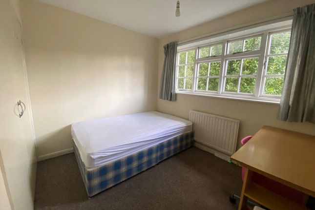 A Bright And Inviting Double Bedroom With Ample Na...
