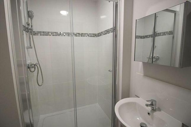 Modern Bathroom Featuring A Spacious Shower With S...
