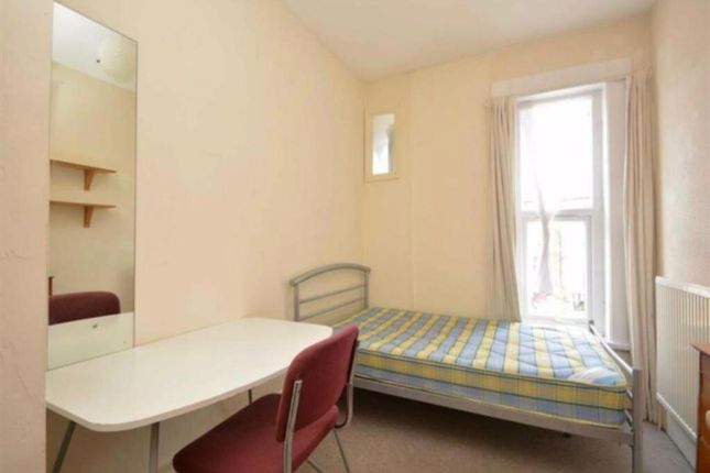A Cozy Single Bedroom With Ample Natural Light And...