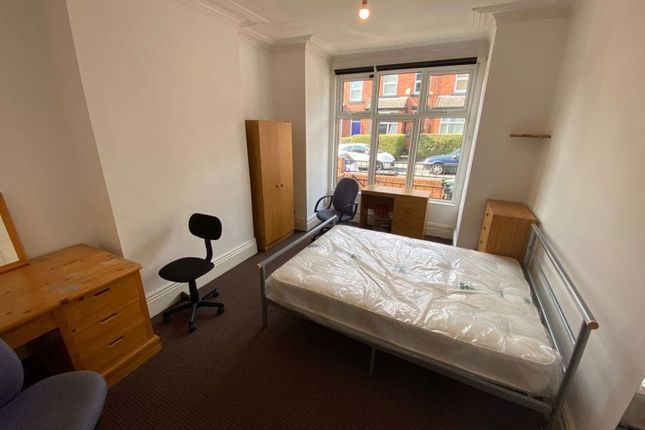 A Bright And Tidy Double Bedroom Featuring A Comfo...