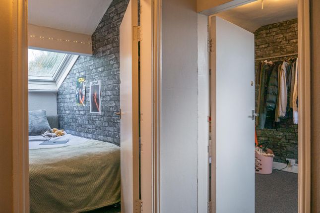 A Well-Lit Master Bedroom Featuring A Comfortable ...