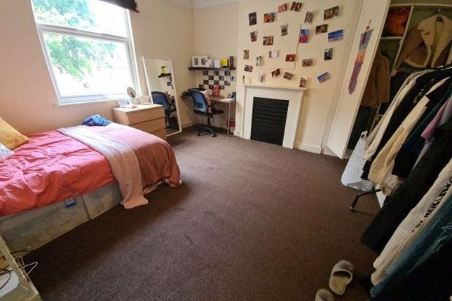 Cozy Single Bedroom Featuring A Comfortable Bed By...