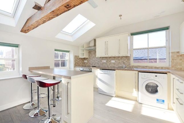 Bright And Modern Kitchen Featuring A Breakfast Ba...