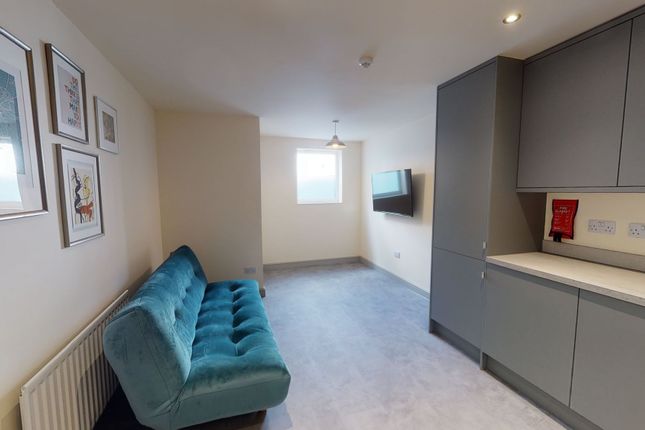 A Bright And Contemporary Living Room With A Large...