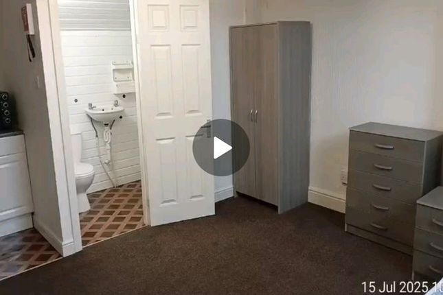 A Neatly Arranged Double Bedroom Featuring A Wardr...
