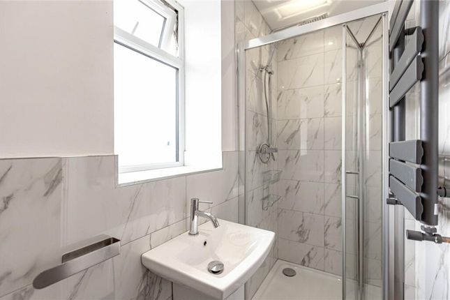 A Modern And Pristine Bathroom Suite Featuring A S...