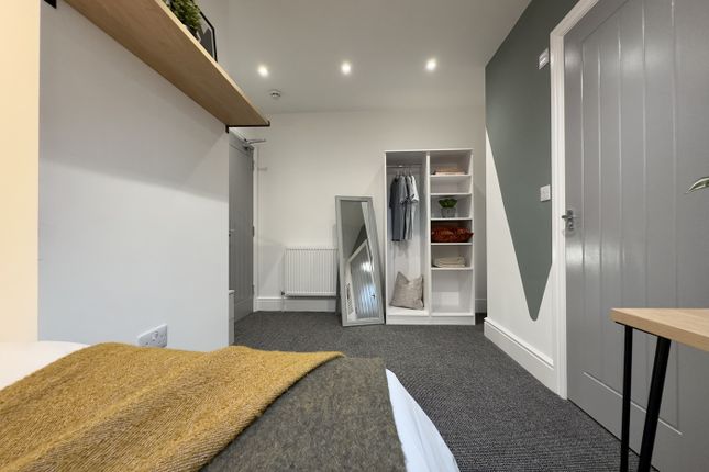 A Bright And Tidy Double Bedroom With Stylish Deco...