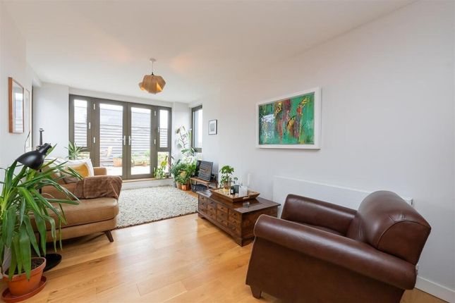 A Bright And Inviting Living Room Featuring Large ...