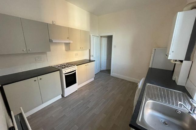 Bright Galley-Style Kitchen With Modern Laminate F...