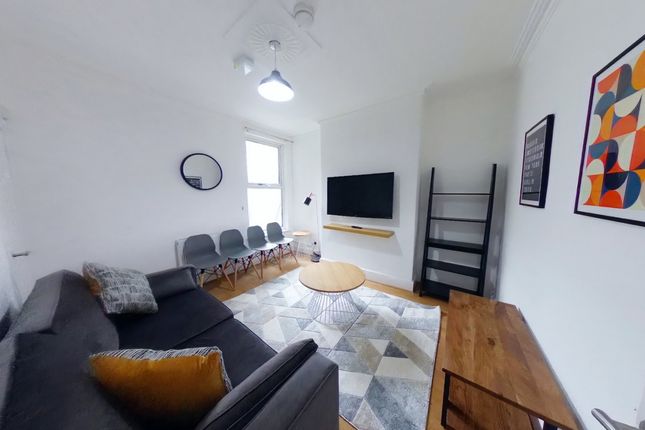 A Spacious And Inviting Large Modern Living Room F...