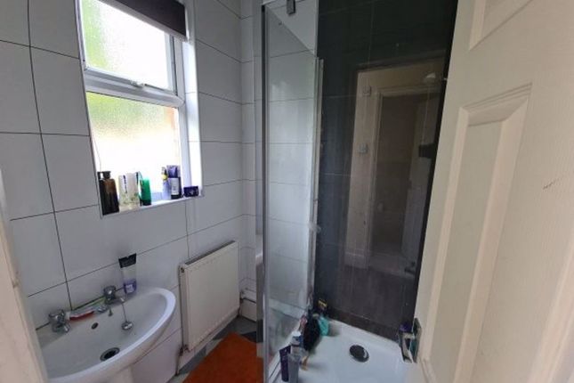 A Modern Bathroom Featuring A Clear Glass Shower E...