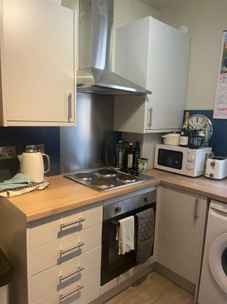 A Modern And Tidy Kitchenette Featuring Essential ...
