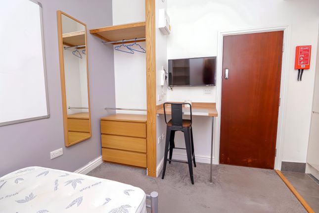 A Modern And Tidy Double Bedroom Featuring A Styli...