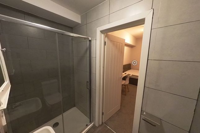 A Clean And Functional Bathroom Featuring A Shower...