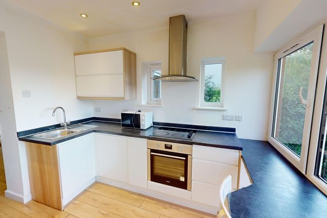 A Bright And Modern Kitchenette With Ample Natural...