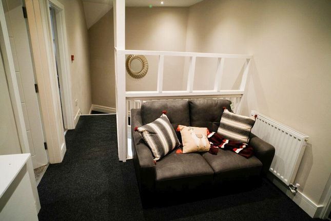 A Neat And Well-Maintained Hallway Area Featuring ...