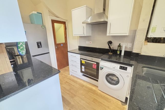 A Modern, Well-Maintained Kitchen Featuring White ...