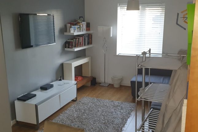 Bright, Modern Living Room With A Wall-Mounted TV,...