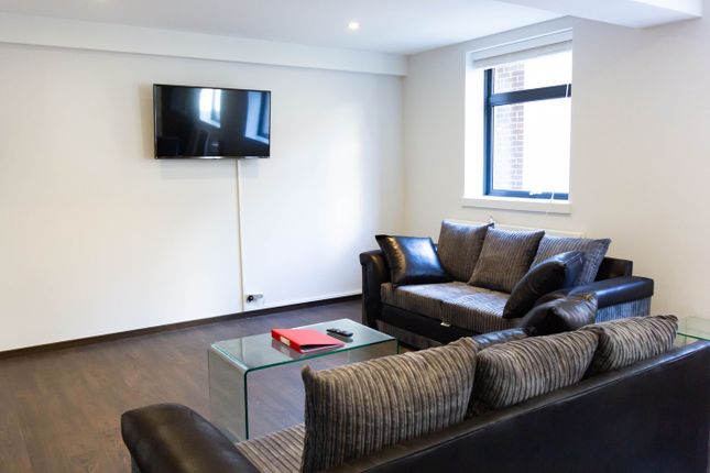 A Spacious And Modern Living Room, Perfect For Soc...