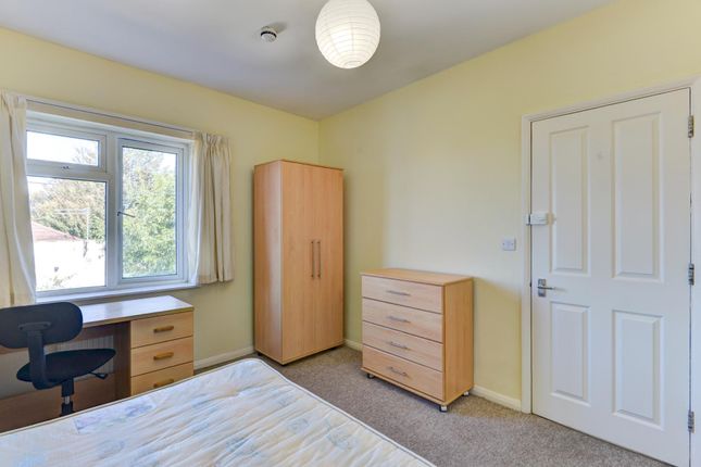A Bright And Tidy Bedroom Featuring A Large Wardro...