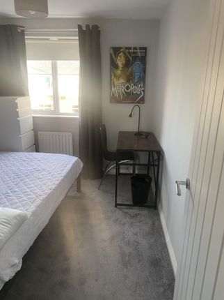 A Bright And Inviting Double Bedroom Featuring A S...