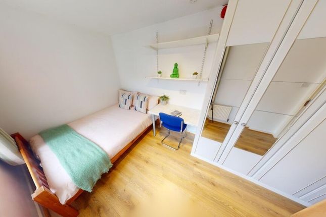 Bright And Clean Compact Toilet Area Featuring A m...