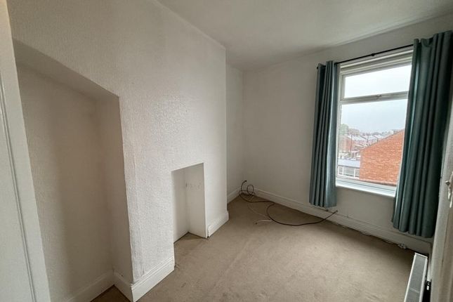 A Bright, Simple Bedroom Featuring A Large Window ...