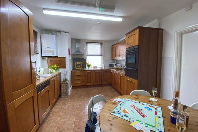 Warm, Well-Equipped Kitchen With Plentiful Wooden ...