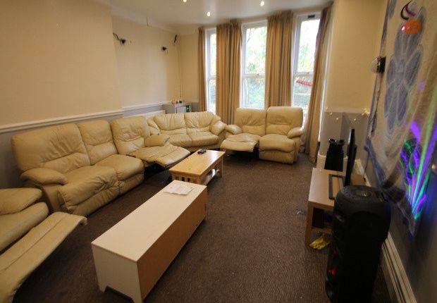 A Spacious, Well-Lit Living Room Featuring Comfort...