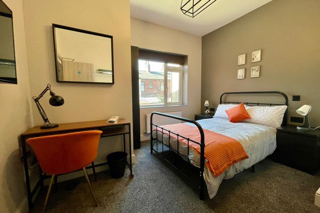 This Inviting Double Bedroom Features A Stylish De...