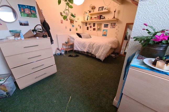 A Cozy Bedroom With A Comfortable Double Bed And P...