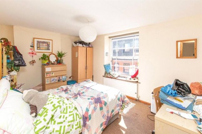 A Spacious Master Bedroom Featuring A Large Double...