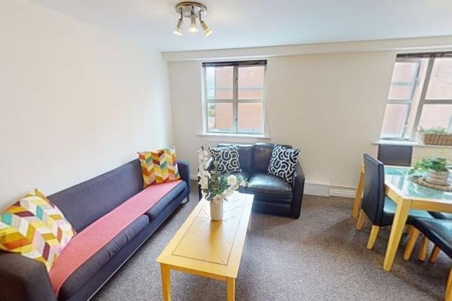 Bright And Welcoming Living Room Featuring Comfort...