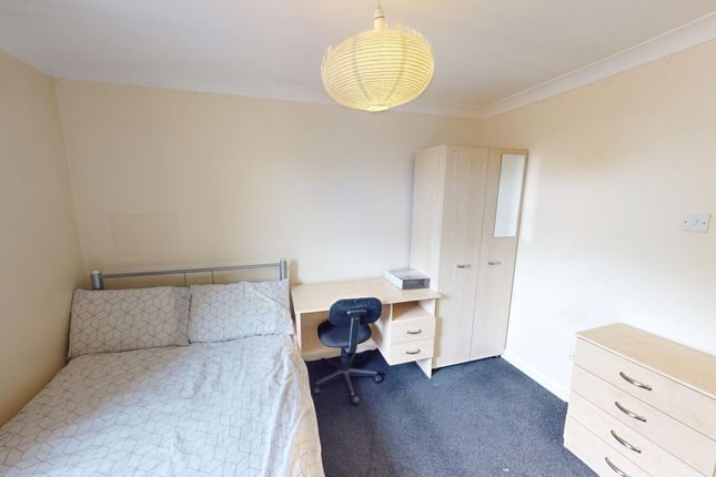 A Cozy And Tidy Double Bedroom With A Desk And Amp...