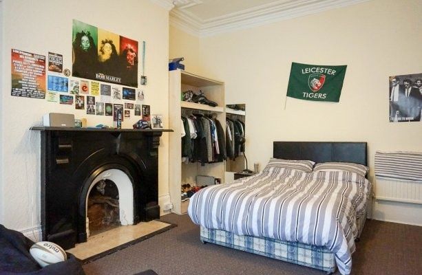 A Well-Maintained Double Bedroom Featuring A Comfo...