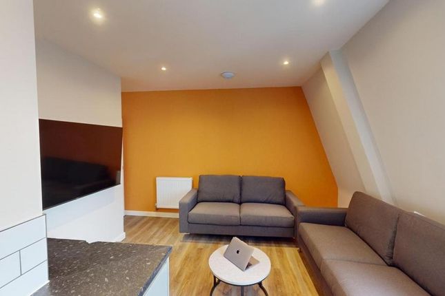 A Spacious And Inviting Modern Living Room With Br...