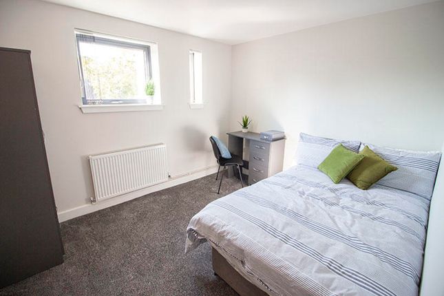 A Cozy Double Bedroom Featuring A Comfortable Bed ...