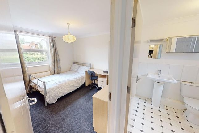 A Bright And Tidy Double Bedroom Featuring A Comfo...