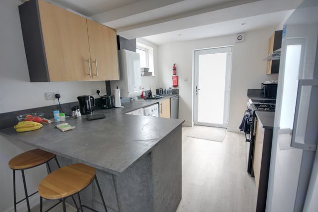 A Modern And Tidy Kitchenette With Ample Natural l...