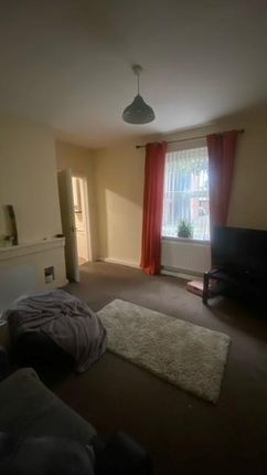 Bright Front-Facing Living Room With A Large Windo...