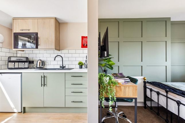 This Stylish Double Bedroom Features A Cozy Sleepi...